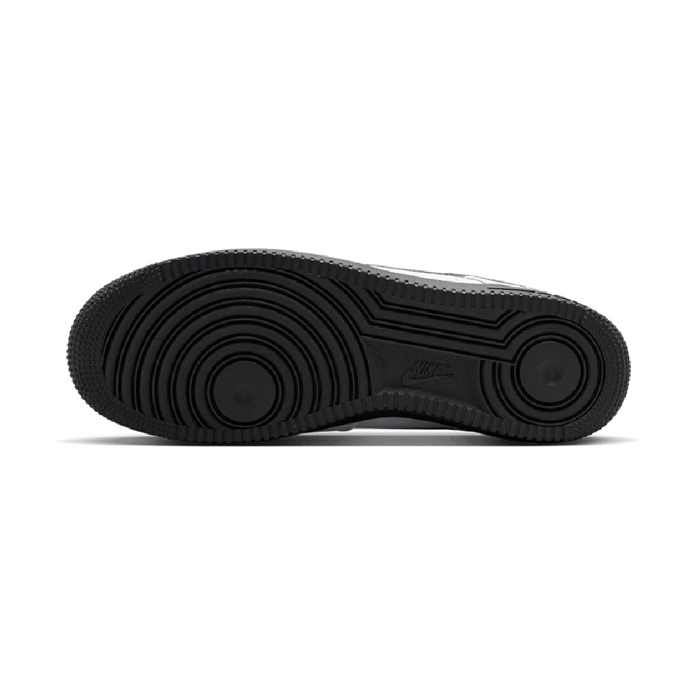 Black rubber outsole tread for white low-top sneakers with textured traction.