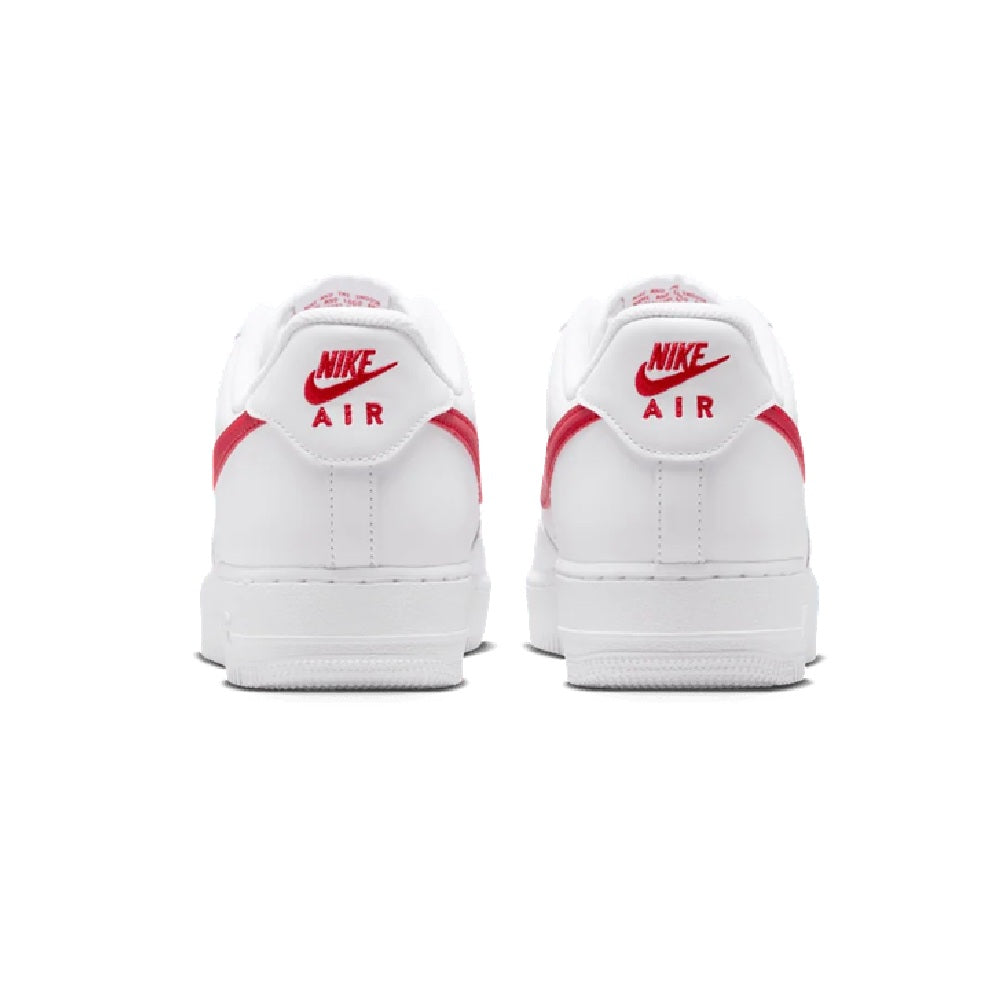 Nike Air Force 1 low-top sneakers, white back view with red accents on heel tabs.