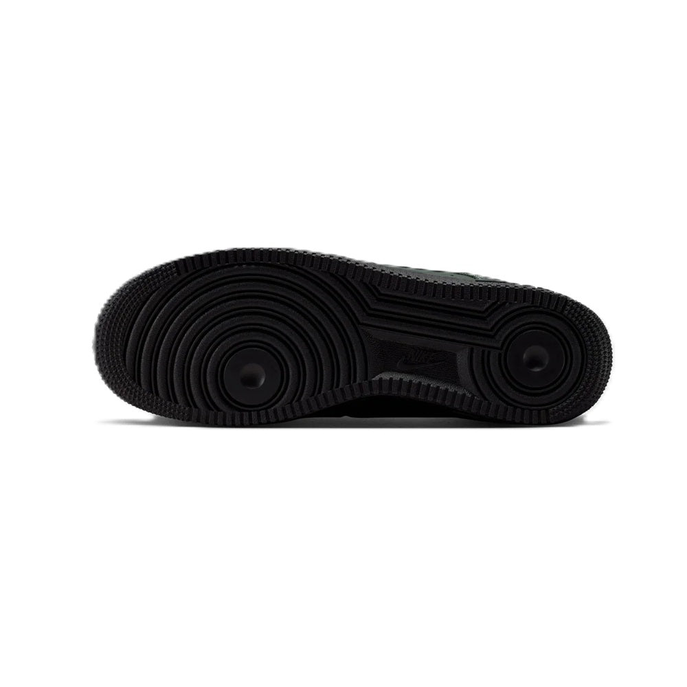 Black rubber outsole for Nike Air Force 1 low-top sneaker with traction tread