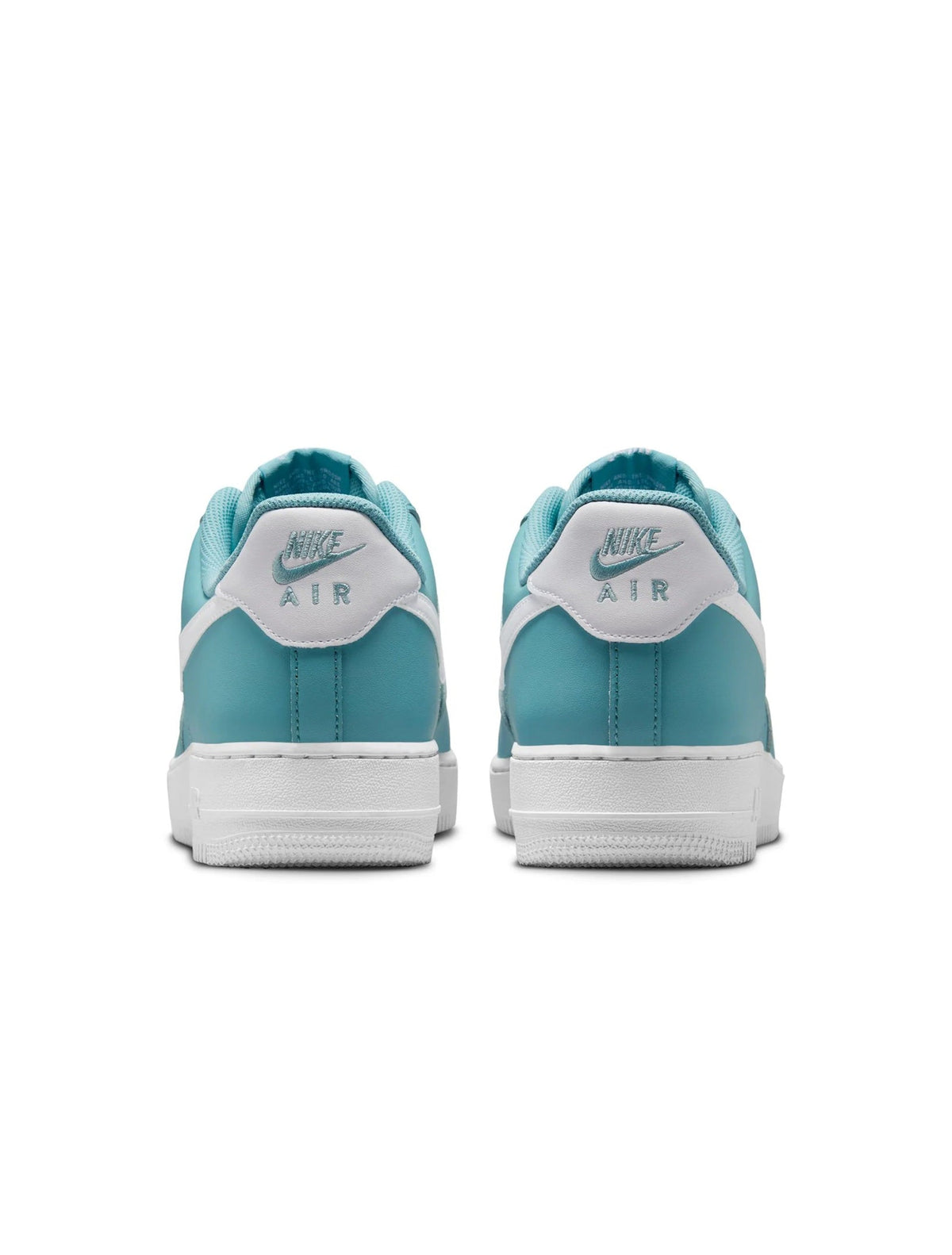 Turquoise low-top sneakers with white heel tab and Nike Air branding