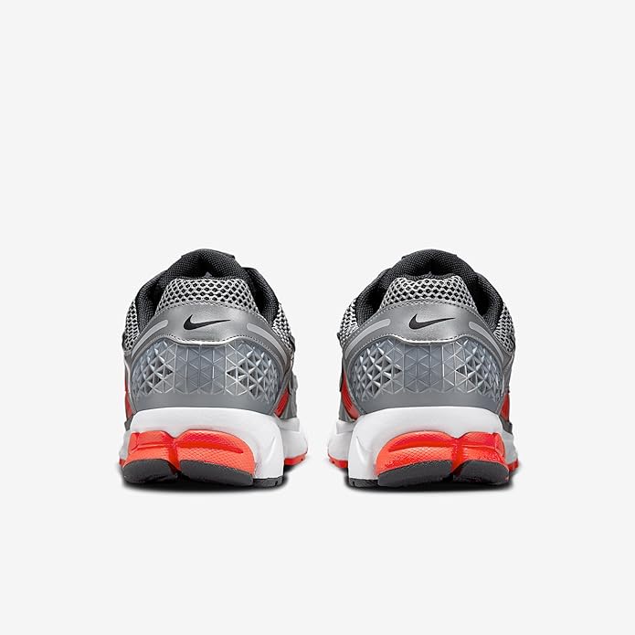 Nike Zoom Vomero 5 running shoe, heel view, silver mesh back with red midsole