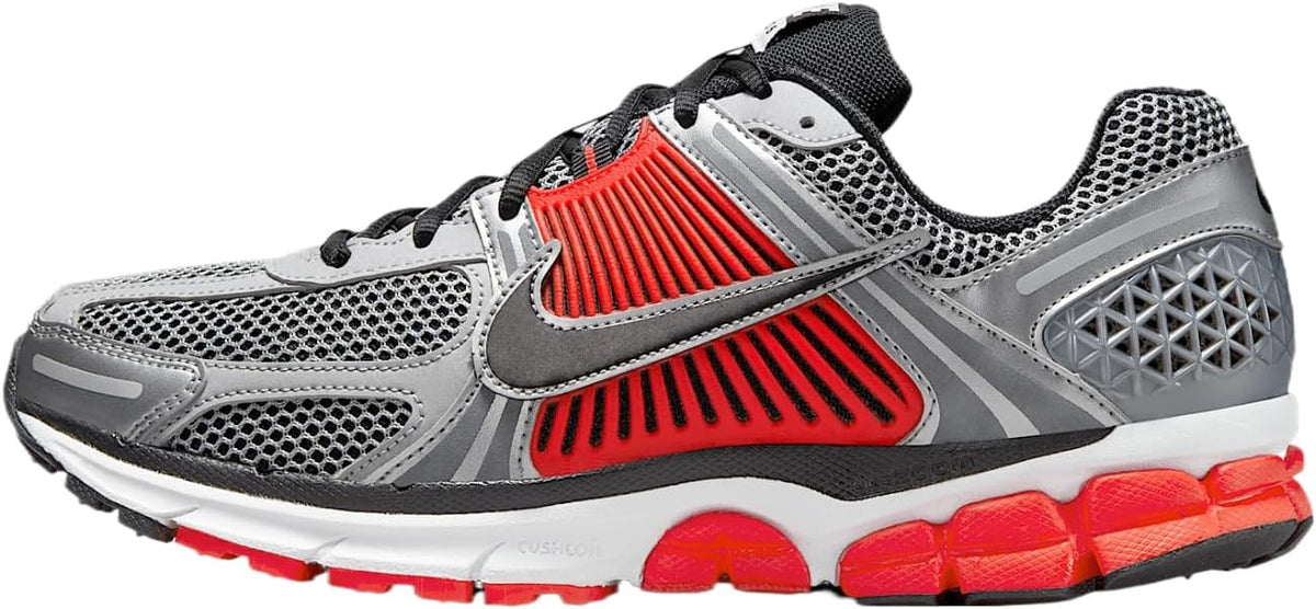 Nike Zoom Vomero 5 running shoe with metallic silver mesh, black trim, red accents
