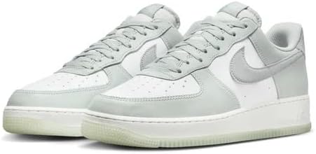 Nike Air Force 1 low-top sneakers, light silver upper with lace-up and white sole.
