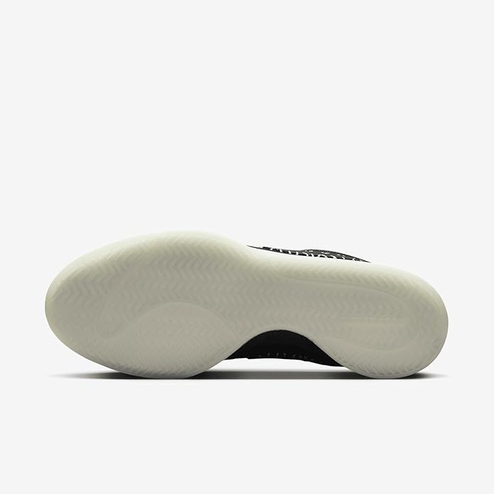 Black Nike low-top sneaker with textured off-white rubber outsole