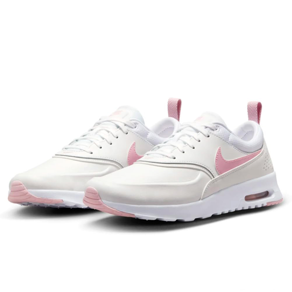 White Nike Air Max Thea PRM sneakers with pink laces and side swoosh, pair view