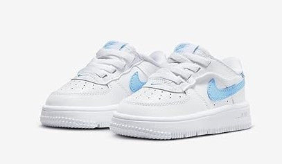 Toddler Nike Air Force 1 Low sneakers, pair view with light blue accents on white