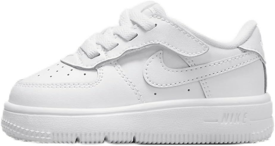 Toddler low-top lace-up sneakers in white with Nike swoosh and grippy rubber sole