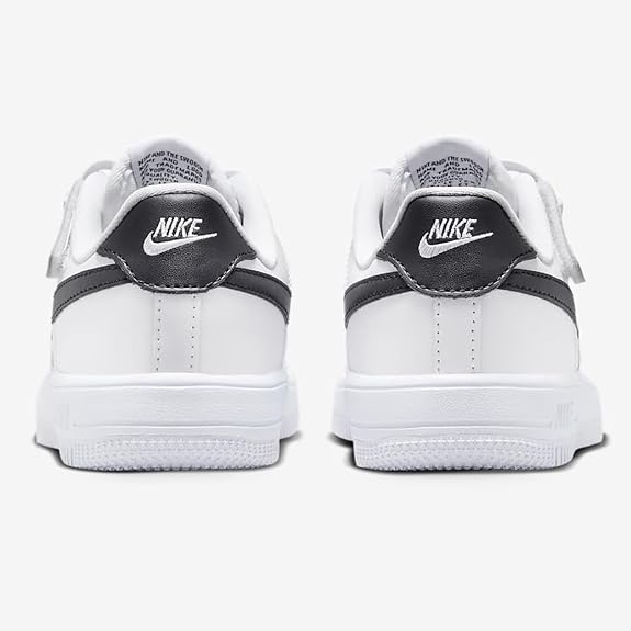 Kids white sneaker heel view with black strap and Nike Swoosh