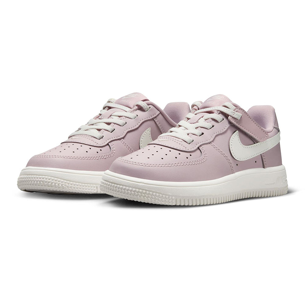 Pair of kids low-top sneakers in rose and sail with white Swoosh overlays