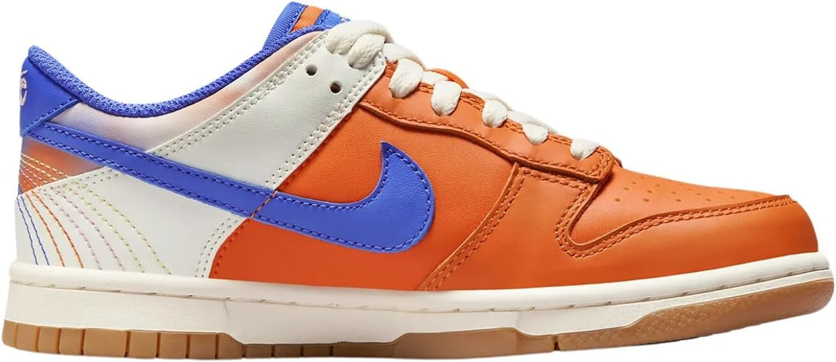 Big kids' Nike Dunk Low SE sneakers, orange upper with blue swoosh and white laces