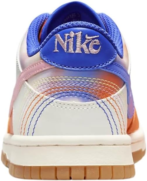 Nike Dunk Low SE heel close-up with blue Nike logo and orange, pink, white panels