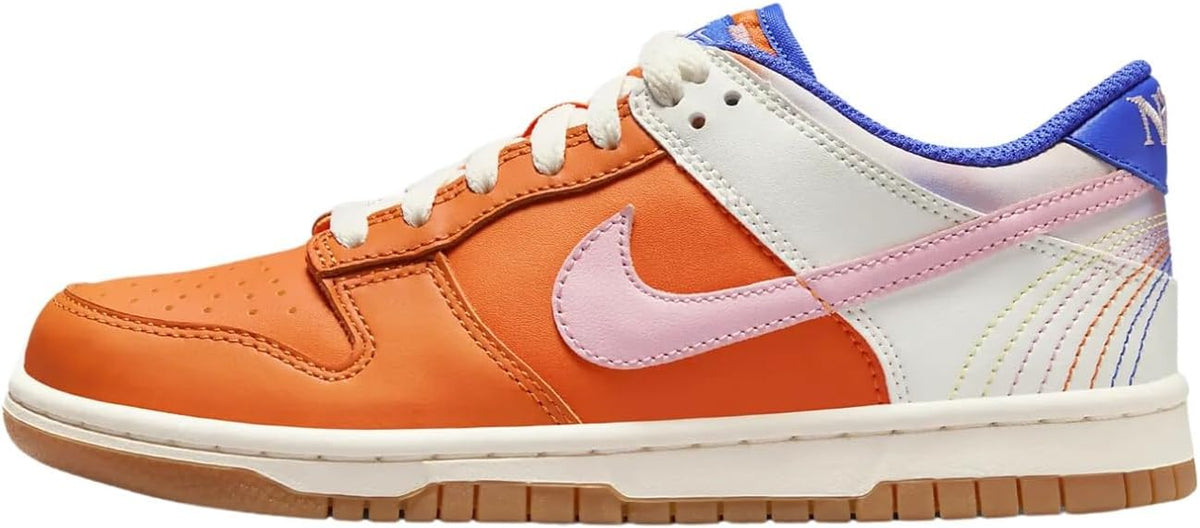 Big kids' Nike Dunk Low SE sneakers in orange, pink, white, and blue trim