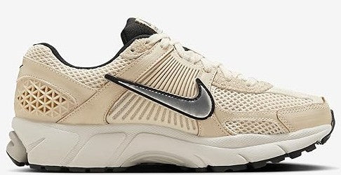Women’s Nike Zoom Vomero 5 side view sneakers in pearl white/bone with black swoosh