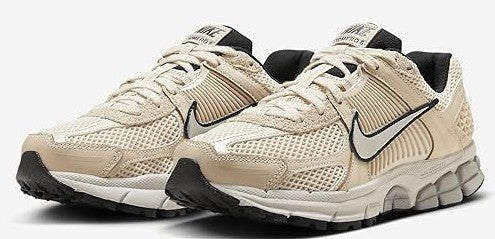 Pair of women’s Nike Zoom Vomero 5 sneakers in pearl white and bone with black accents