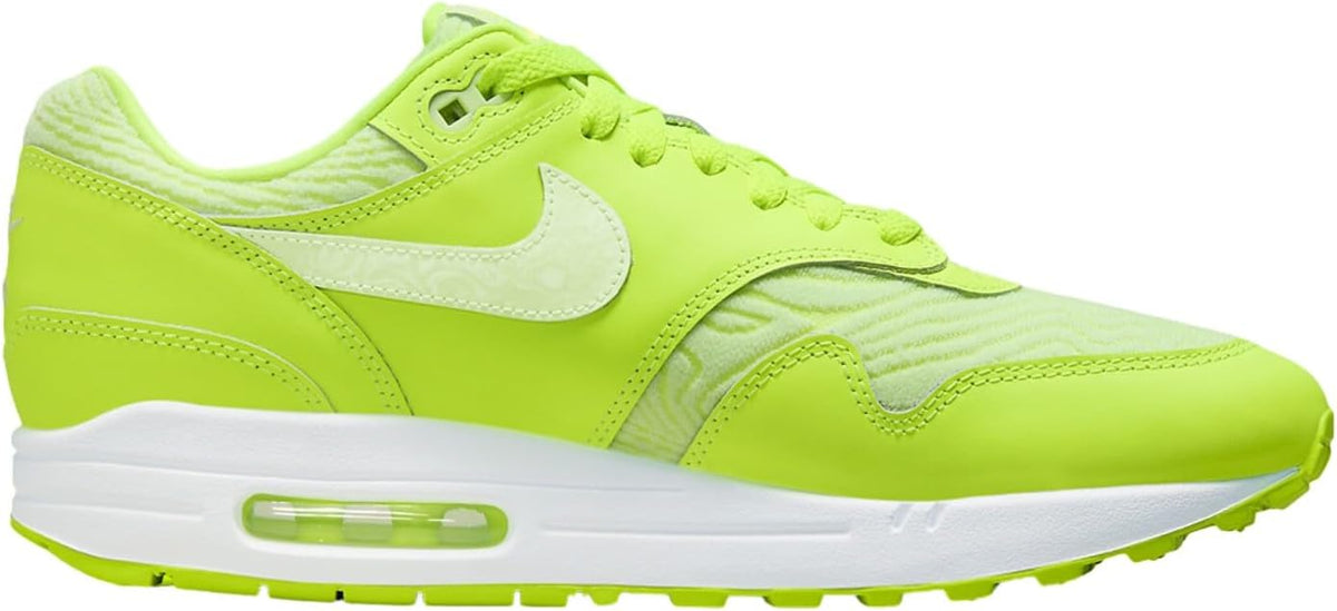 Lime green low-top Air Max 1 PRM sneakers with white Swoosh and Air unit sole