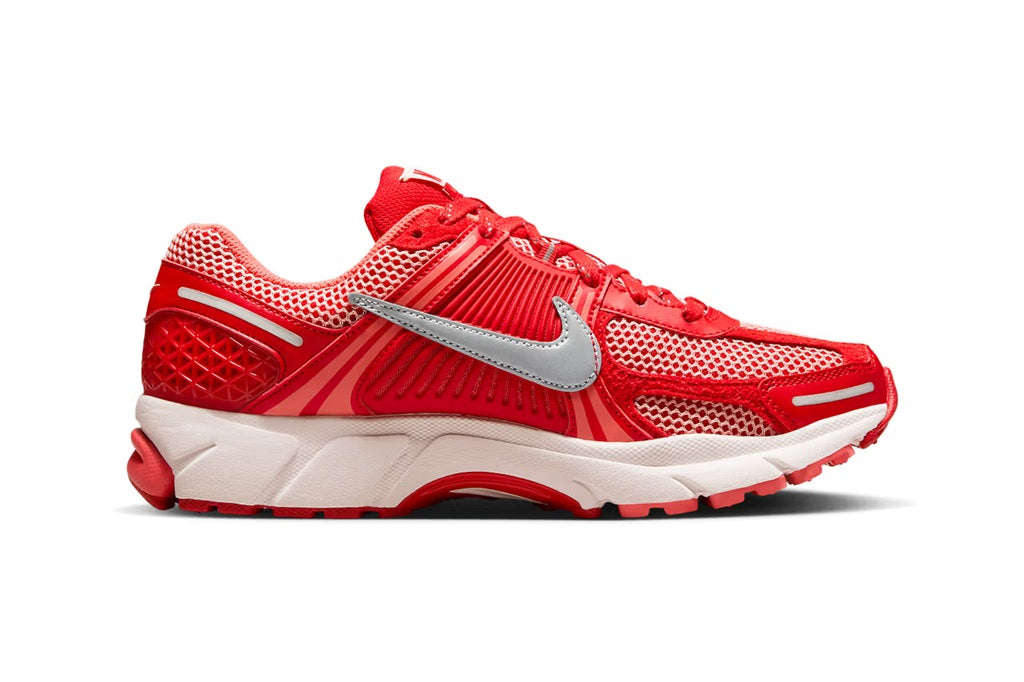 Red mesh running sneaker with silver swoosh and white midsole, side view