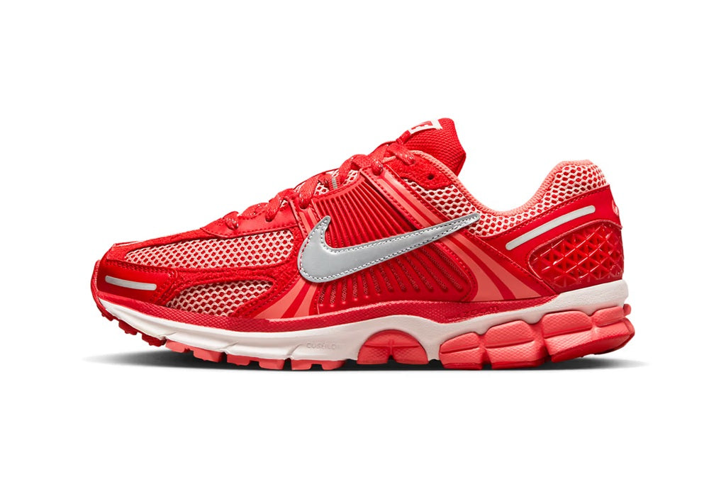 Red mesh running sneaker with silver swoosh and white midsole, front 3/4 view