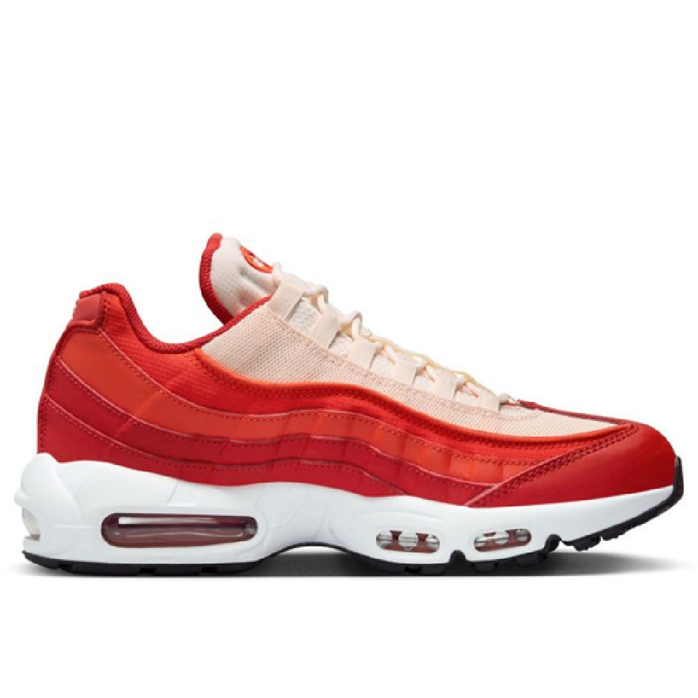 Nike Air Max 95 sneakers with red upper, light laces, and visible air unit pods