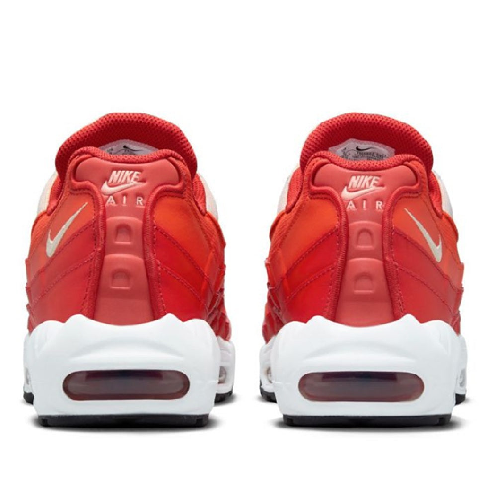Nike Air Max 95 heel view with red back panels, Nike Air branding, and white foam sole