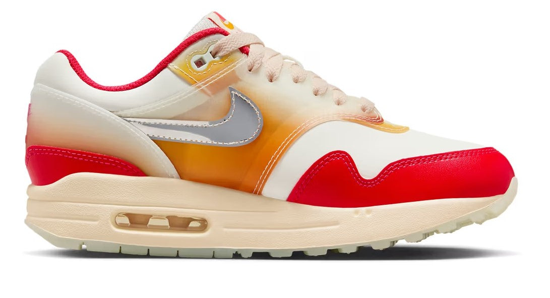 Women's Nike Air Max 1 PRM sneakers, side view: cream leather, red mudguard, silver swoosh