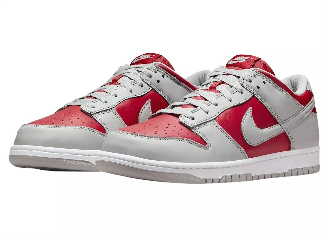 Nike Dunk Low low-top sneakers, front view with red and white toe and gray overlays