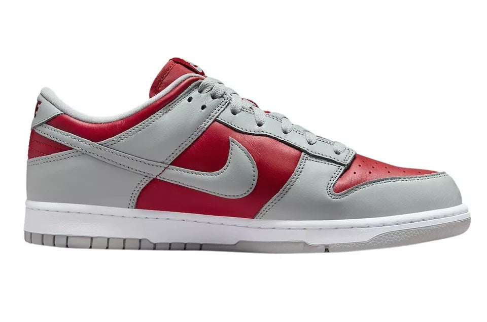 Nike Dunk Low low-top sneakers, side view in white, gray, and varsity red with swoosh
