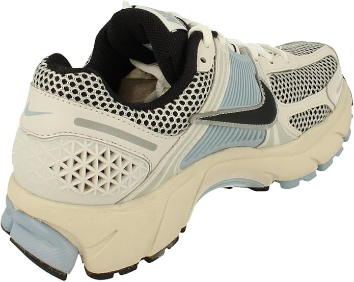 Women's Nike Zoom Vomero 5 running shoe, rear side view with mesh upper and blue midsole.