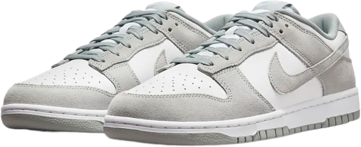 Men's Nike Dunk Low sneakers, white base with perforated toe and light pumice accents