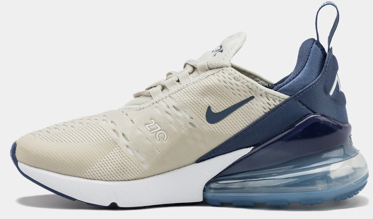 Women’s Air Max 270 sneaker in light bone with navy heel and swoosh, visible Air sole