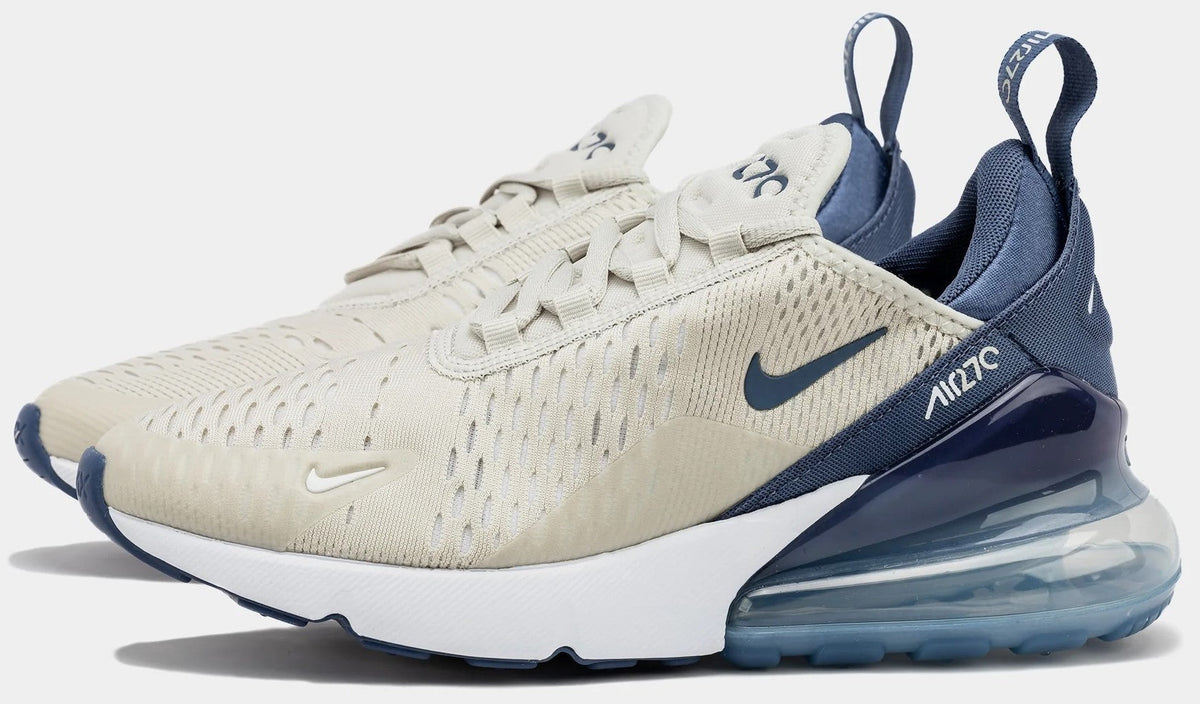Women’s Air Max 270 low-top sneaker with light bone knit upper and navy heel accents