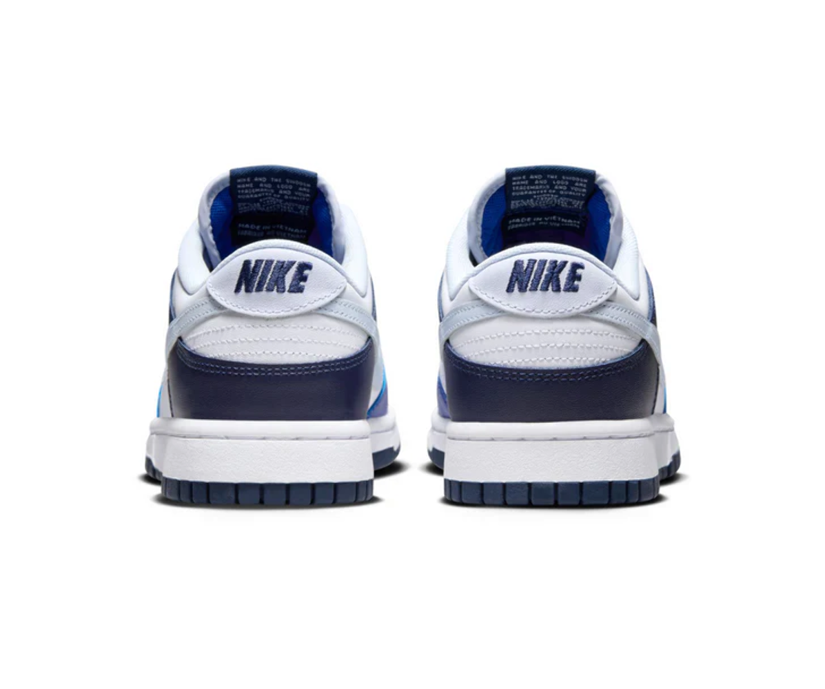 Nike Dunk Low sneakers viewed from the heel, white uppers and blue lining
