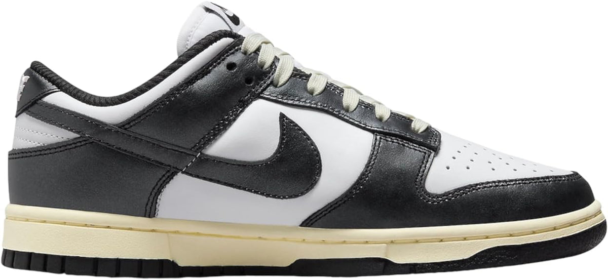 Nike Dunk Low PRM sneakers, black leather panels over white base, lace-up
