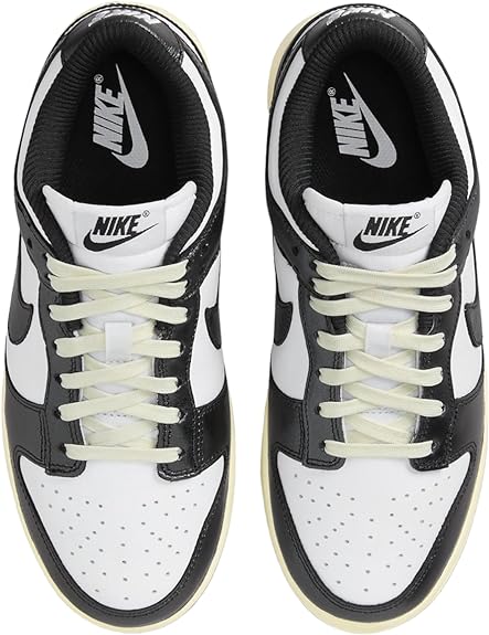 Nike Dunk Low PRM sneakers, tongue and lace view with Nike logo, white and black
