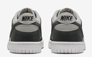 Nike Dunk Low sneakers, back view with NIKE heel branding and dark gray uppers