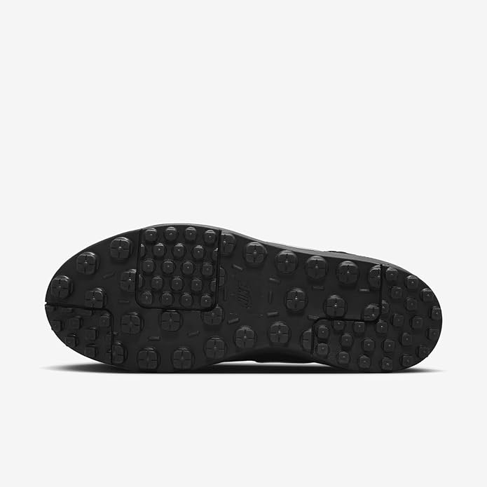 Black Nike sneaker outsole with raised rubber studs for traction