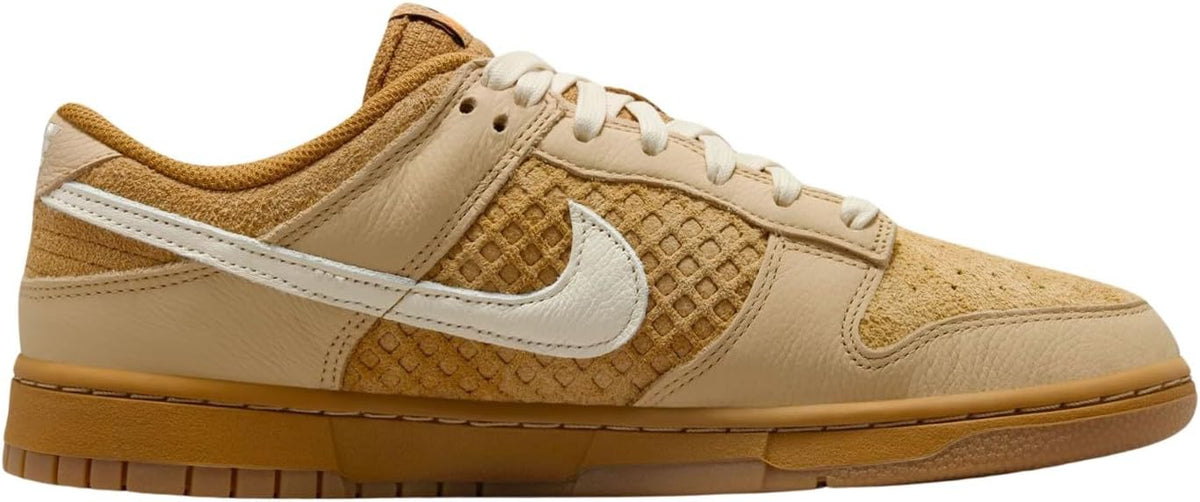 Men's Nike Dunk Low retro sneakers with beige leather panels, white Swoosh and laces.