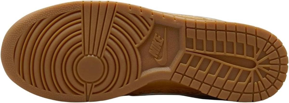 Nike Dunk Low retro gum-brown rubber outsole with circular traction pattern.