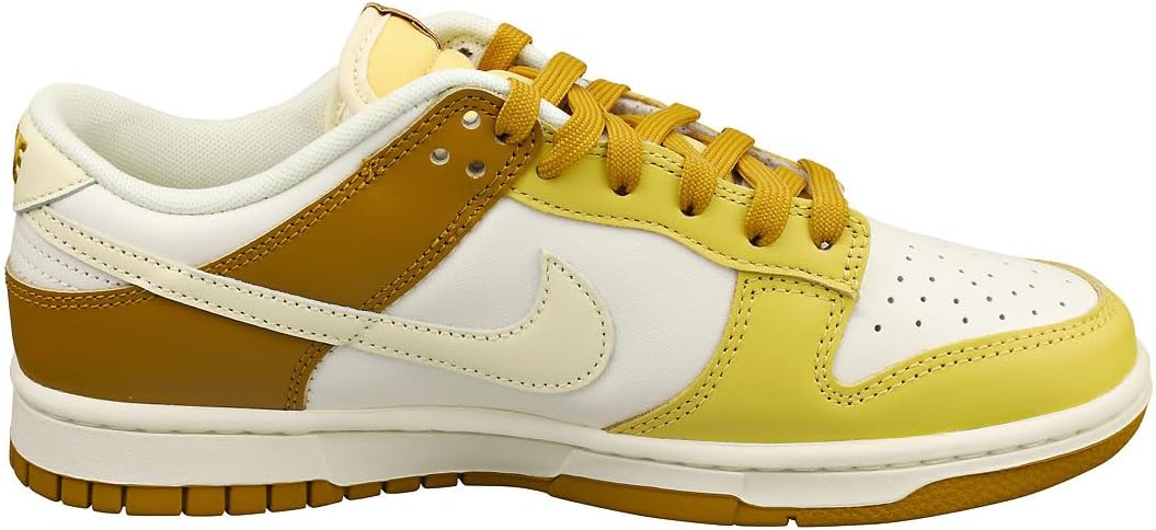 Men's Nike Dunk Low low-top sneakers, side view: cream with gold panels and yellow laces