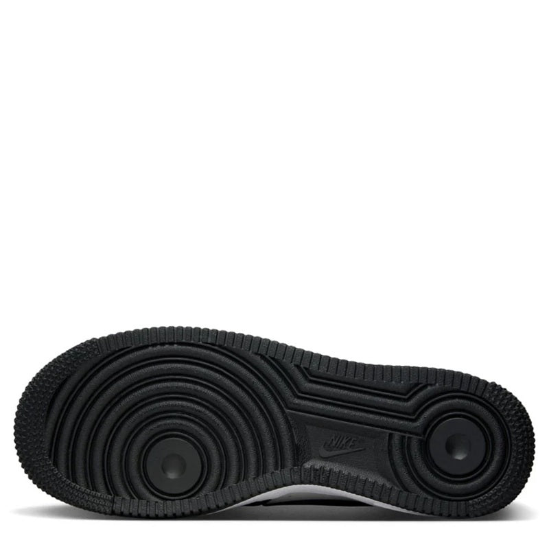 Kids' Nike Air Force 1 rubber outsole with circular tread pattern, black.