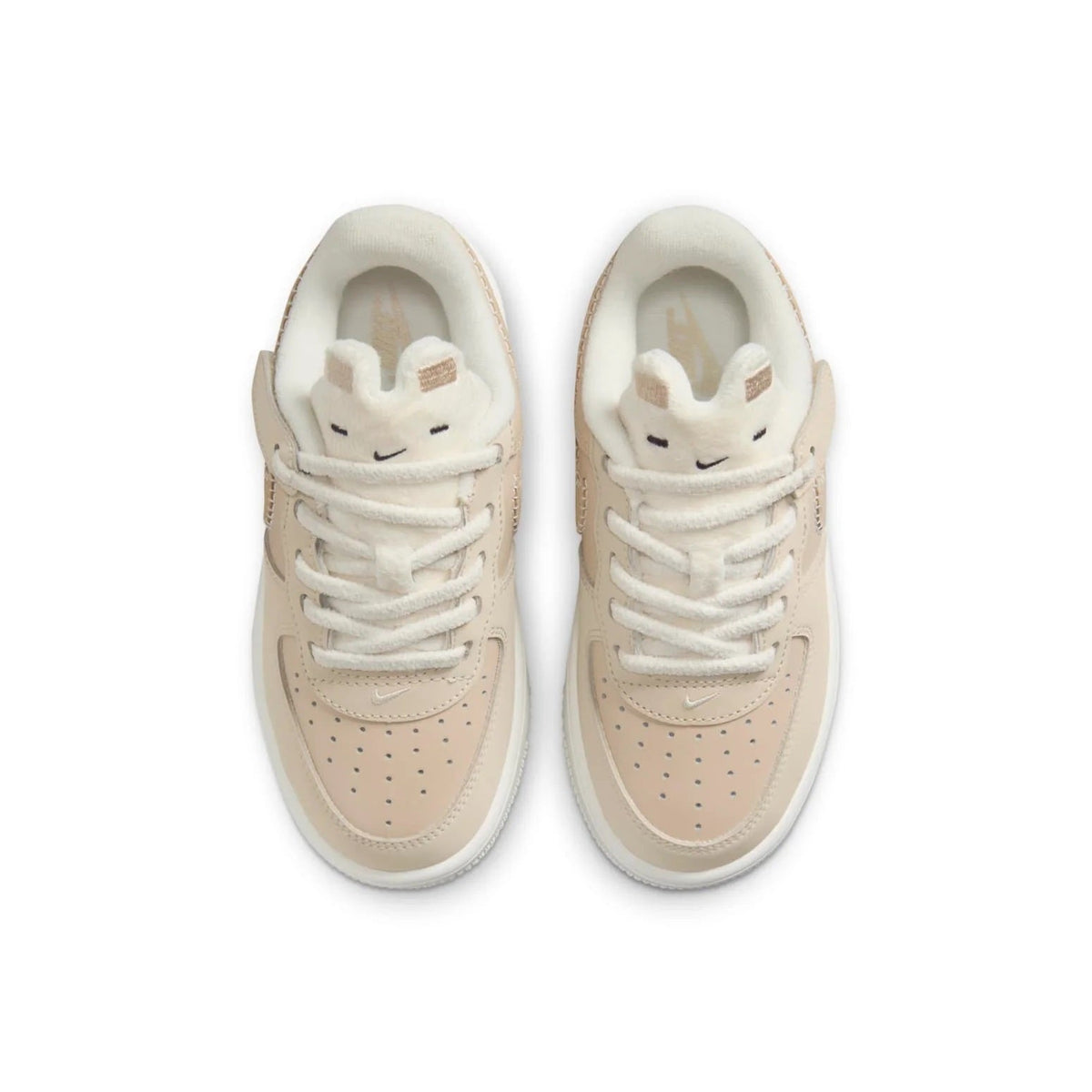 Kids lace-up sneakers in light beige with Swoosh logo and perforated toe box