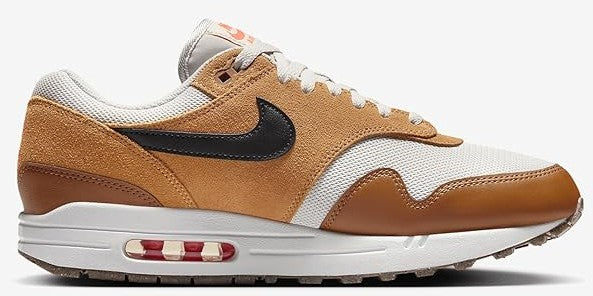 Light bone and brown lace-up sneaker with black swoosh and visible air-cushion window