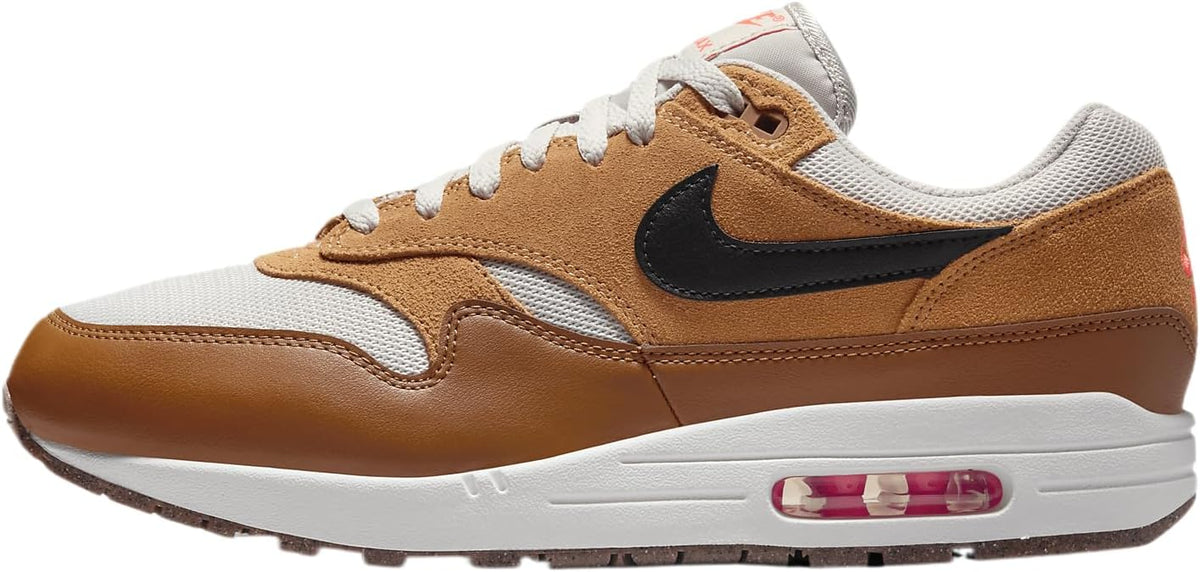 Nike Air Max 1 low-top sneaker in light bone, brown suede, and black swoosh