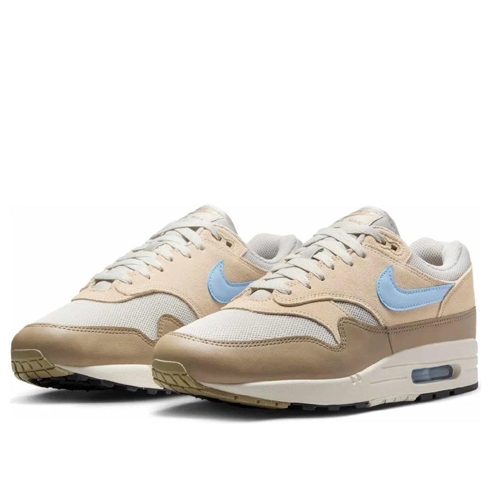 Men's Nike Air Max 1 ESS sneakers, pair view; light bone with blue accents and Air Max sole