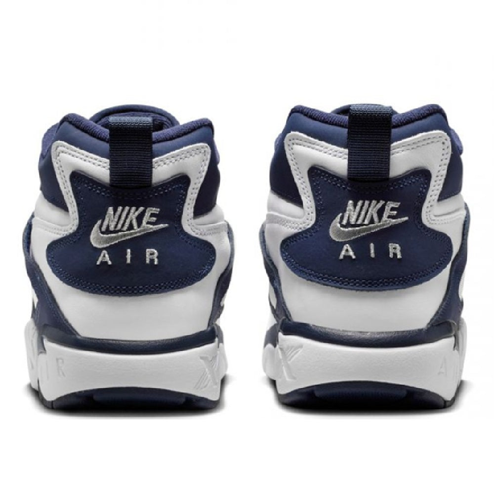 Nike Air Diamond Turf back view, white and navy with Nike Air logo on heel