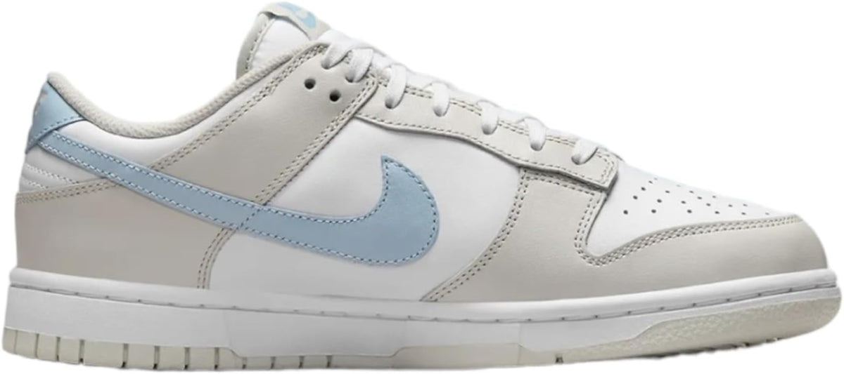 Women’s Nike Dunk Low sneakers, white leather upper with light blue Swoosh detail