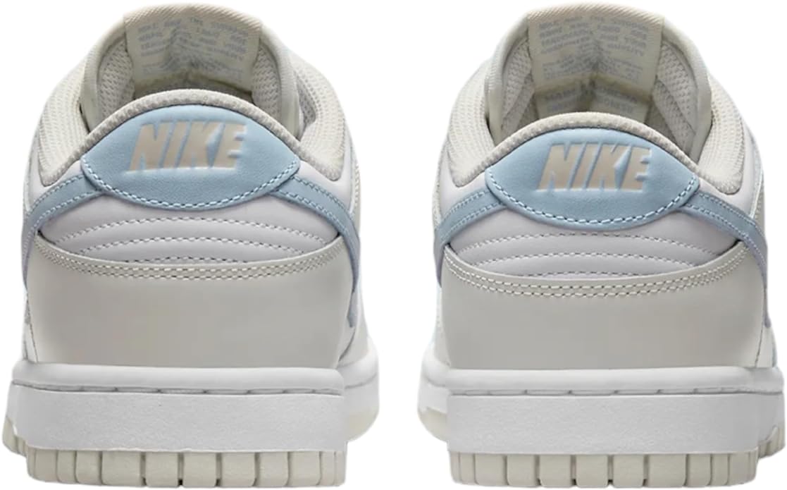 Women’s Nike Dunk Low sneakers, rear view with Nike heel branding and light blue accents