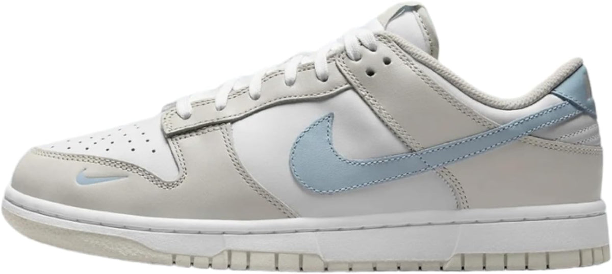 Women’s Nike Dunk Low sneakers in white with light blue Swoosh and perforated toe
