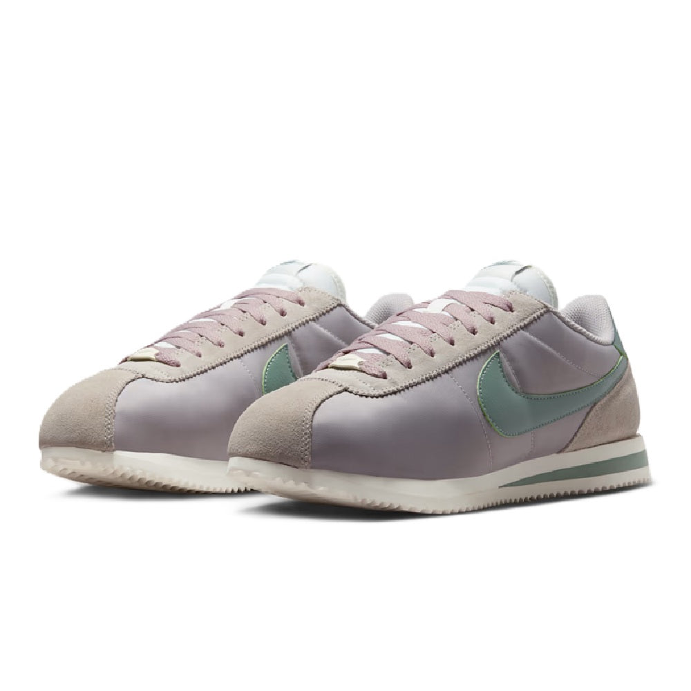 Men's Nike Cortez TXT sneakers, pair front view with green Swoosh and pink laces