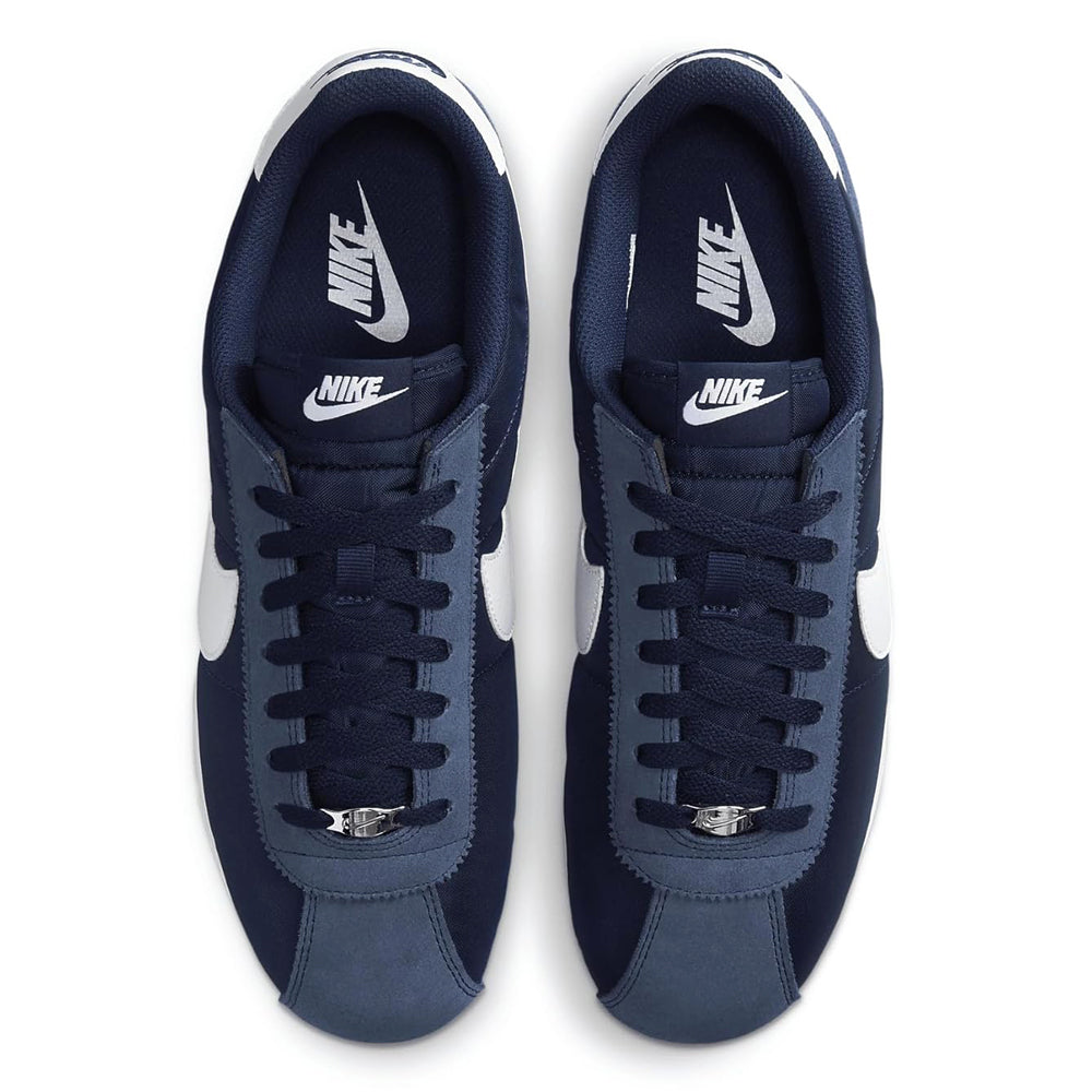 Men's Nike Cortez TXT sneakers showing navy tongues with Nike logos and lace-up vamps