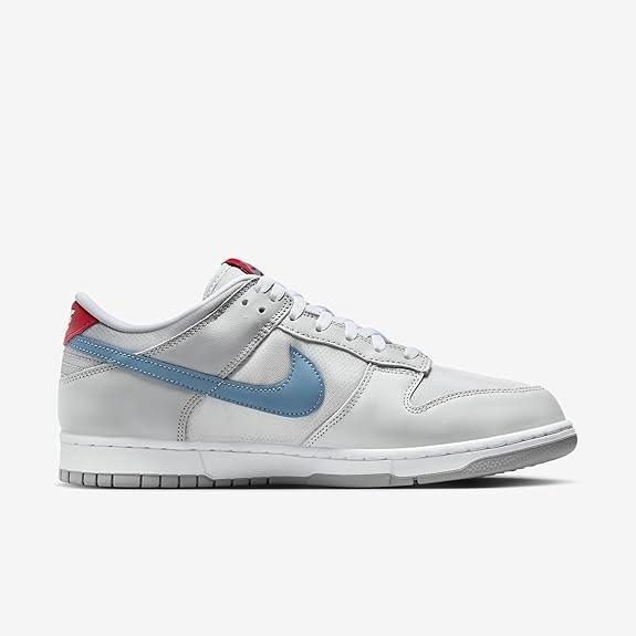Nike Dunk Low QS side view sneakers, white leather with light blue swoosh and red heel tab.